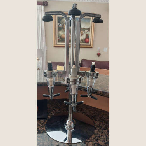 Liquor Dispensers Four Bottle Rotating Bar Optic Stand was listed for